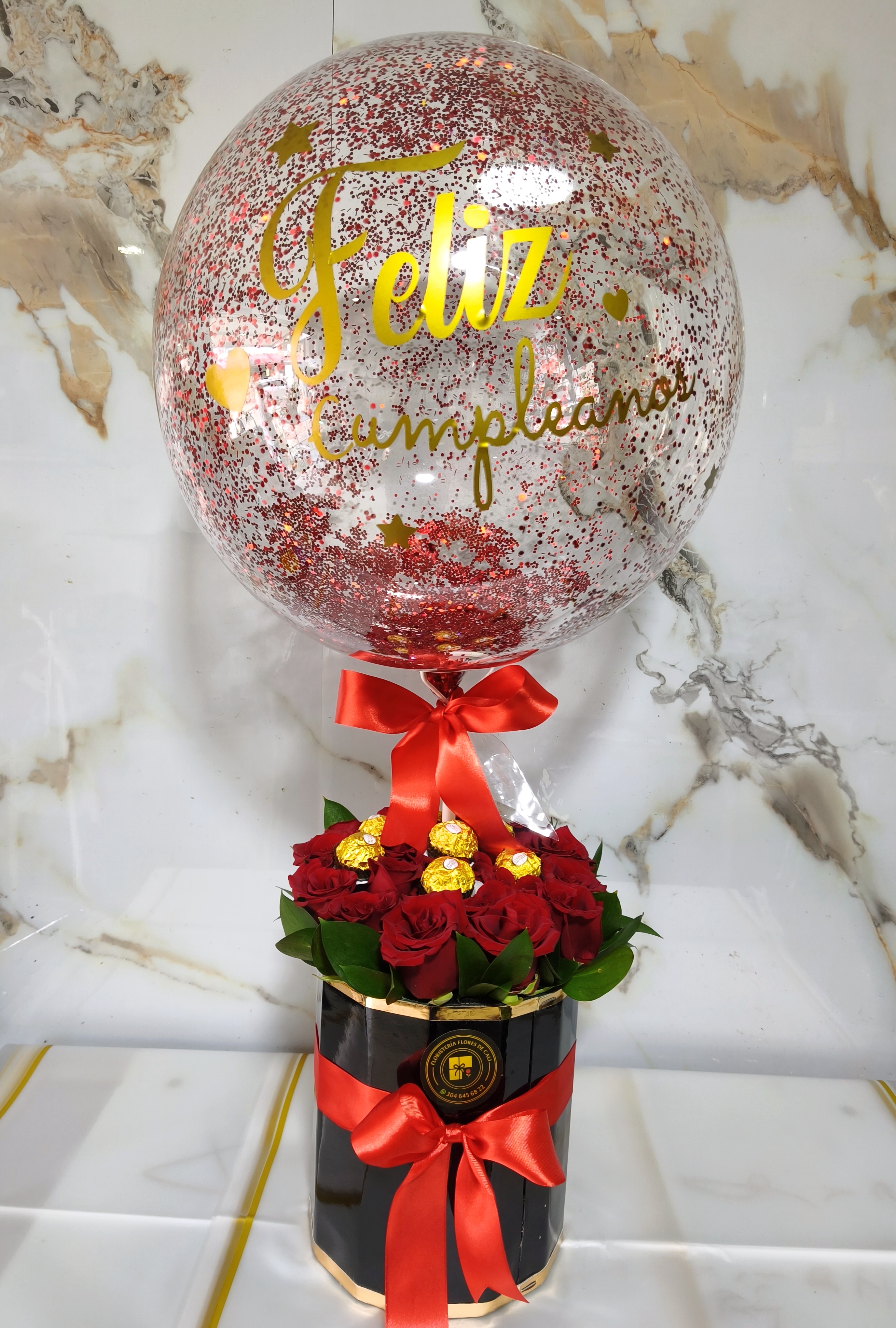 Cilindro con chocolates y globos